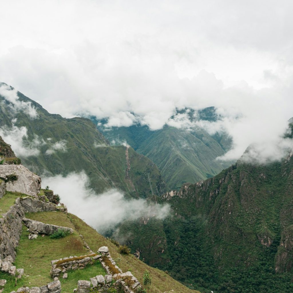 green and gray mountains under white clouds during daytime