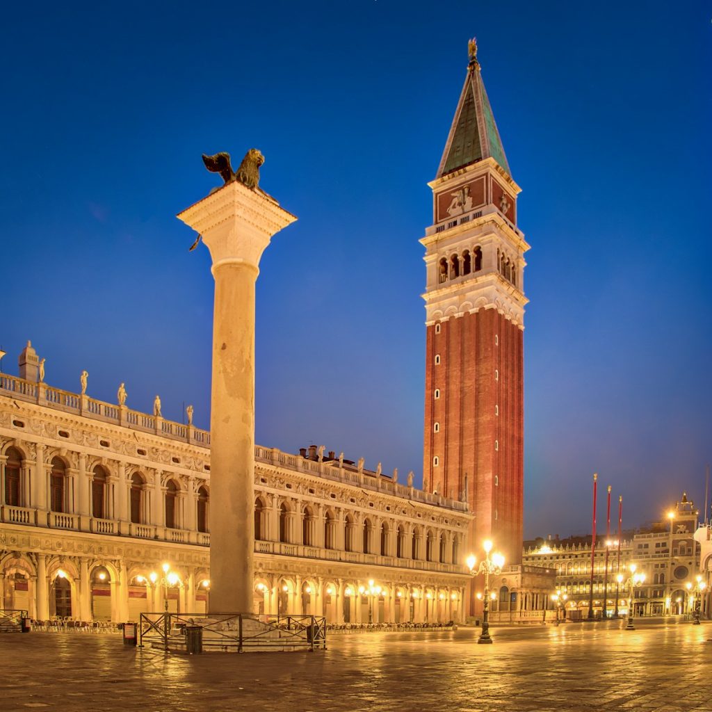 brown and white buildings at nighttime